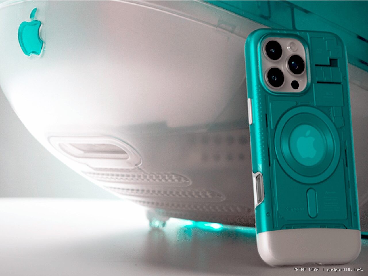 白い古いパソコンとアップルマークのついた緑色のスマホケース